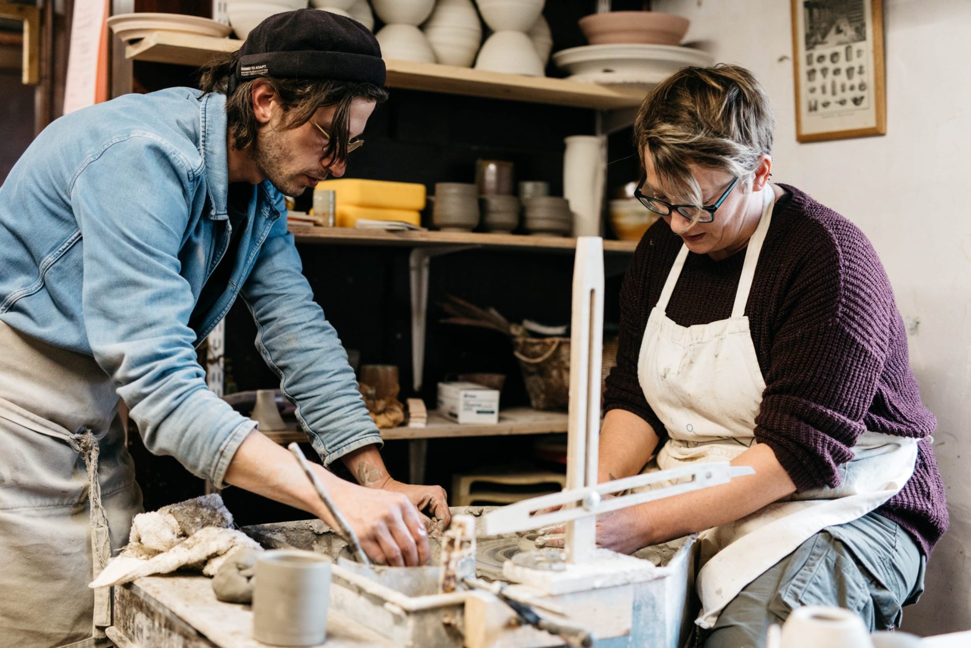 Francis Lloyd-Jones and a student at the potter's wheel.
